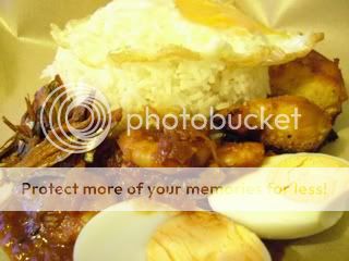 Nasi lemak bungkus with telur (goreng & rebus), ayam goreng kunyit and sambal udang